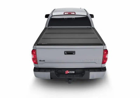 BAK 2022+ Toyota Tundra 5.5ft Bed BAKFlip MX4 Bed Cover installed on a silver truck.