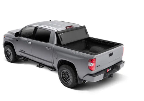 2022+ Toyota Tundra with 5.5ft bed featuring the BAKFlip MX4 matte finish aluminum bed cover, showcasing its flush mount design and robust tailgate seal.