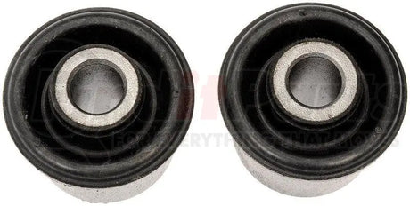 Two black rubber BC69116 Dorman Bushing with metal centers for auto repairs
