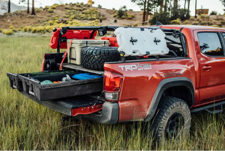 Red pickup truck with bed drawer system, 2000-pound load capacity, adjustable design