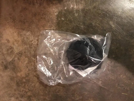 Black rubber hardware kit for Penda Bed Liners in clear plastic packaging