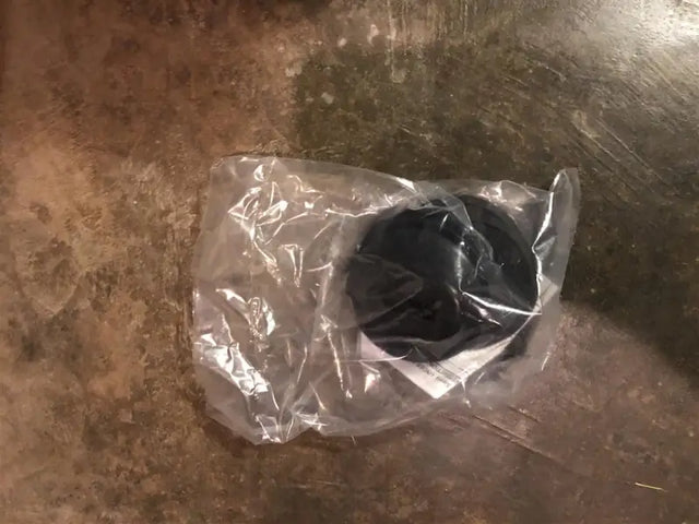 Black rubber hardware kit for Penda Bed Liners in clear plastic packaging