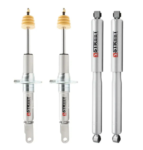 Four silver shock absorbers for street performance on classic 4WD RAM trucks