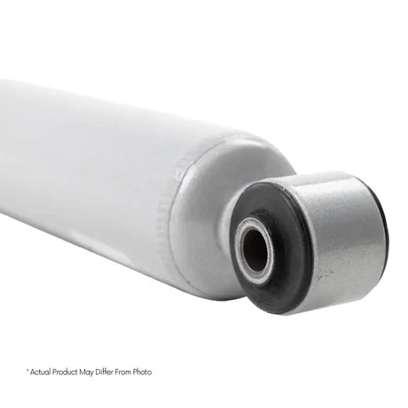 White shock absorber for trail performance on Silverado Sierra Tahoe Suburban trucks