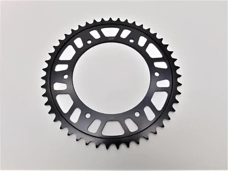 Black metal rear steel sprocket with circular and triangular cutouts for BikeMaster BMW 520 47T