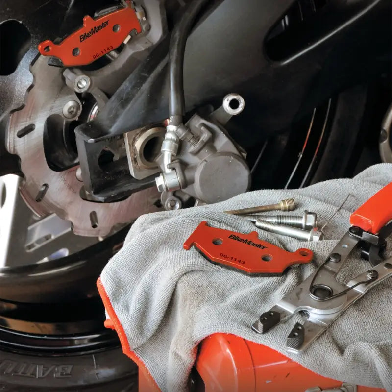 Motorcycle brake pads and tools featuring BikeMaster Cagiva Sintered Brake Pads for Cagiva Sintered Brake upgrade