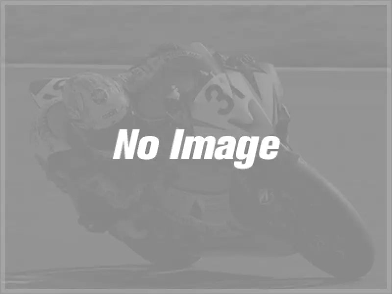 Motorcycle racer leaning into a turn with BikeMaster Fork Seal for smooth ride