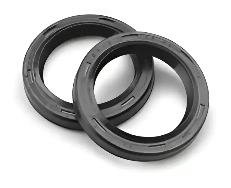 Two black rubber bikemaster fork seals for bike maintenance and replacement