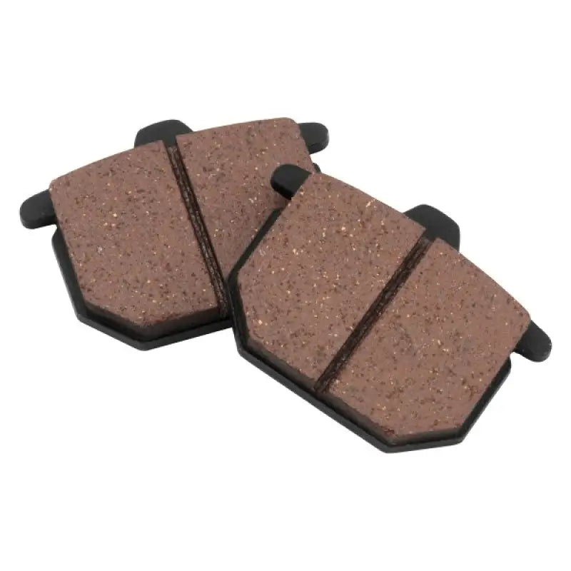 Two brown BikeMaster Honda brake pads for Honda bikes, high-quality brake pads
