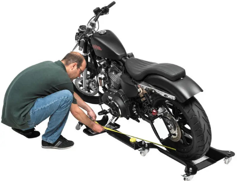 Black motorcycle on a wheeled platform showcasing BikeMaster Polaris Brake Pads