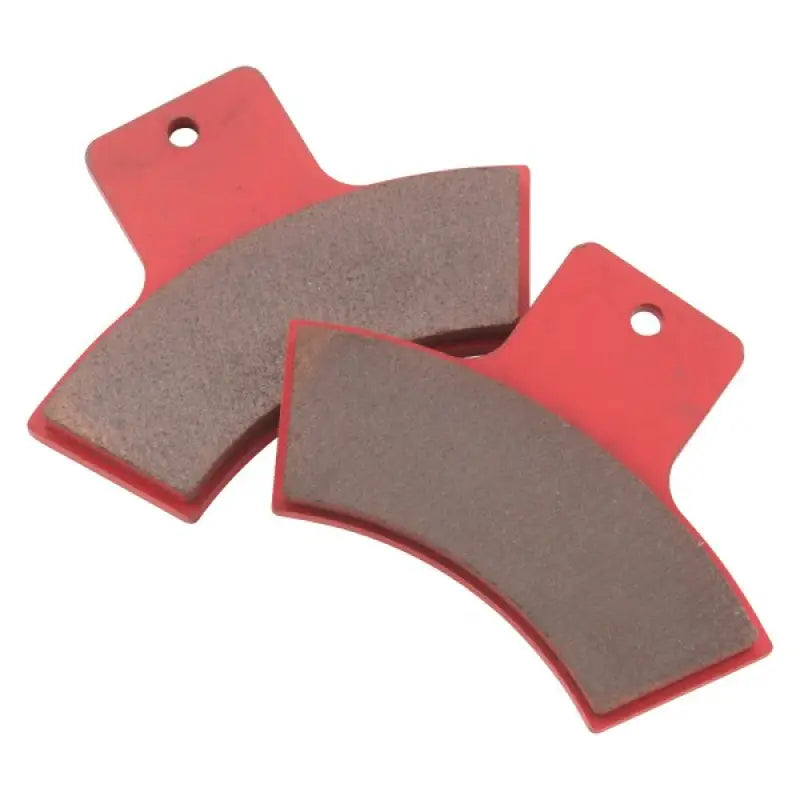 Red and gray brake shoes from BikeMaster Polaris Sintered Brake Pads for Polaris Sintered Brake