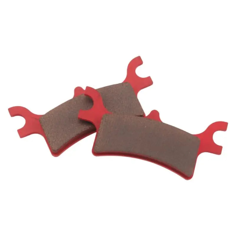 Three red and brown BikeMaster Polaris Sintered Brake Pads for better braking perfomance