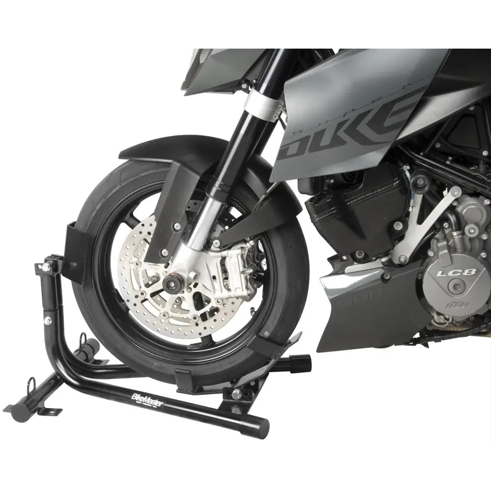 BikeMaster Universal Steel Roll-On Stand - 151573 holding a motorcycle securely by its front wheel.