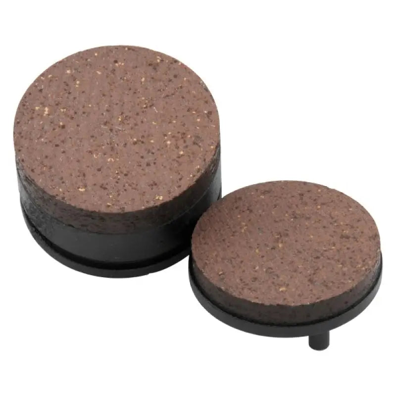 Two round BikeMaster Yamaha Brake Pads for Yamaha brake pads replacement