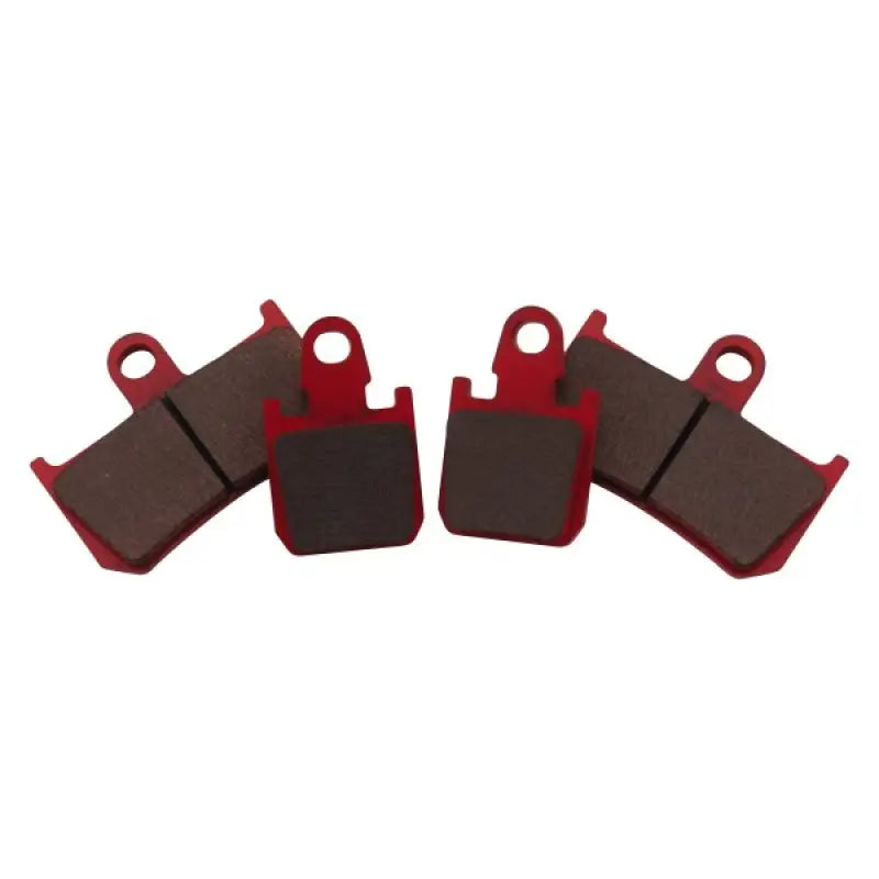 Four red and brown BikeMaster Yamaha Sintered Brake Pads for bike brake upgrade