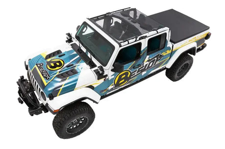 Customized white Jeep Gladiator with roll bar and windshield mount for sun protection