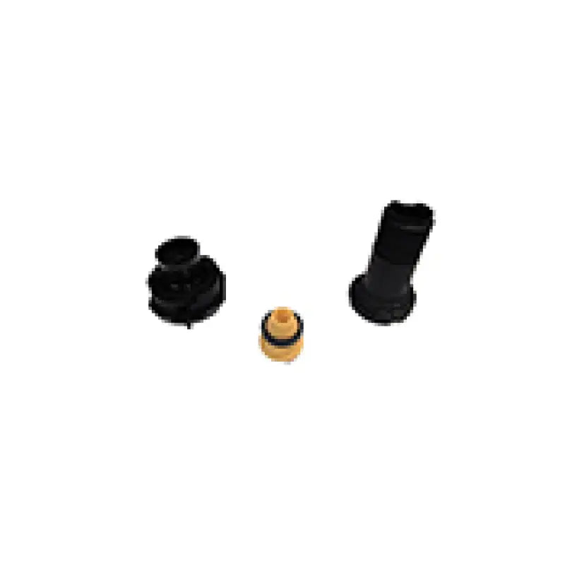 Assorted black and tan plastic parts for Bilstein B1 MB E-Class shock mounting kit