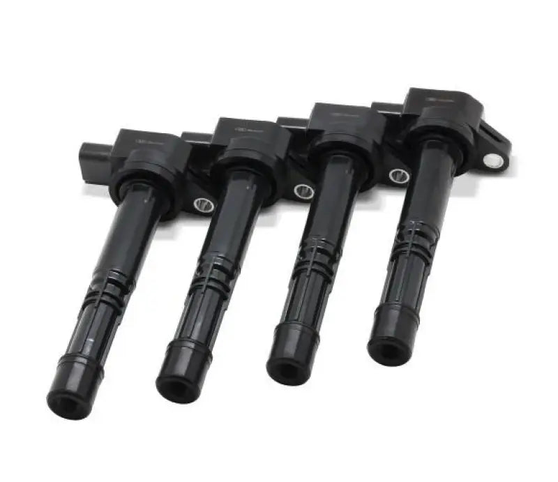 Four black ignition coils from BLOX Honda K-Series Coil Pack Set for Honda K-Series engines