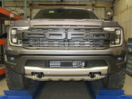Gray Ford truck front with Blue Ox BX2915 Base Plate for easy towing setup