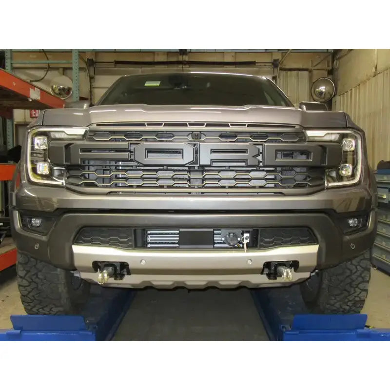 Gray Ford truck front with Blue Ox BX2915 Base Plate for easy towing setup