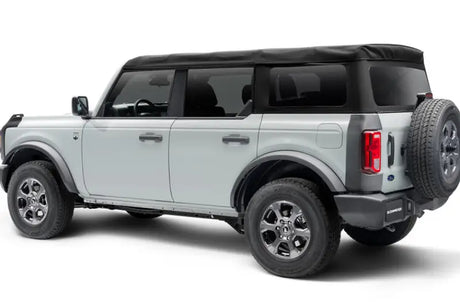 Gray Ford Bronco with black soft top showcasing body corner guard set for side protection