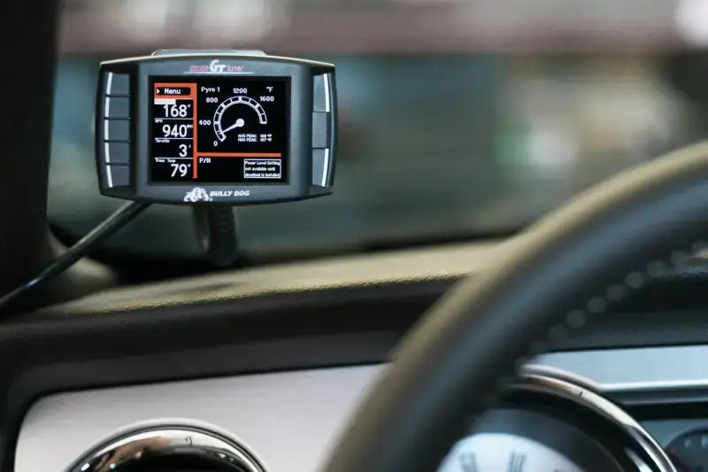 Bully Dog Triple Dog GT Gas Tuner and Gauge installed in a vehicle, displaying performance metrics and diagnostics.