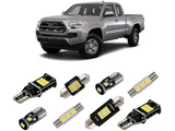 Silver pickup truck with cali raised interior led light kit featuring LED bulbs