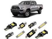 Silver pickup truck with cali raised interior led light kit featuring LED bulbs
