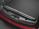 Retractable cargo cover for cargo area liner with raised edges in black TPE material