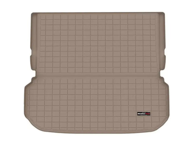Tan gridded cargo area liner with raised edges, non-skid TPE material for SUV cargo area