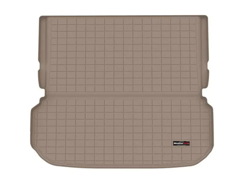 Tan gridded cargo area liner with raised edges, non-skid TPE material for SUV cargo area