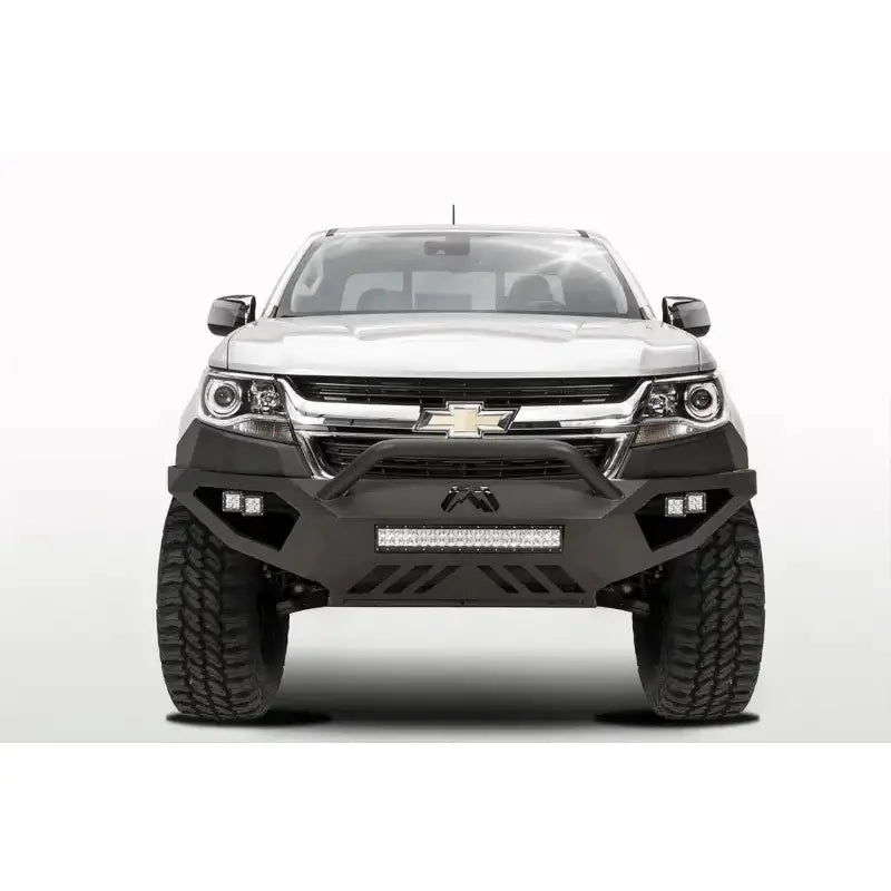 White Chevrolet truck equipped with Fab Fours Vengeance Front Bumper Pre-Runner Guard in black, designed for maximum protection and enhanced rugged appearance.