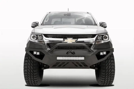White Chevrolet truck equipped with Fab Fours Vengeance Front Bumper Pre-Runner Guard in black, designed for maximum protection and enhanced rugged appearance.