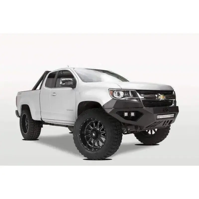 Fab Fours Vengeance Front Bumper with Pre-Runner Guard on a white Chevrolet off-road vehicle.