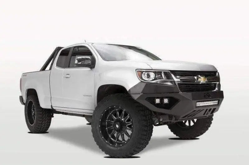 Fab Fours Vengeance Front Bumper with Pre-Runner Guard on a white Chevrolet off-road vehicle.