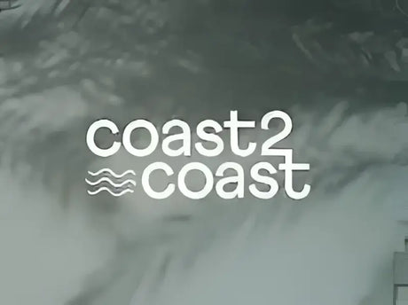 Coast2Coast logo set against a background with abstract palm-like shadows