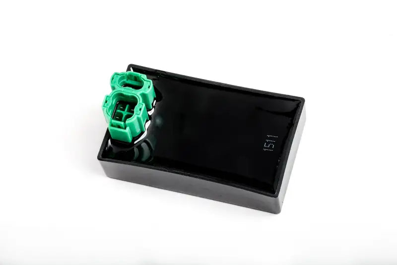 Black electronic control module with green connectors for RV parts & accessories or truck parts