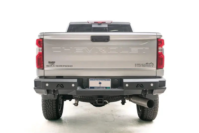 Rear view of a Chevrolet Silverado High Country with the CH20-W4951-1 Fab Fours Premium Rear bumper installed, enhancing protection and style for off-road adventures, Bumpers, Grilles & Guards, AVADA - Best Sellers, Must Haves