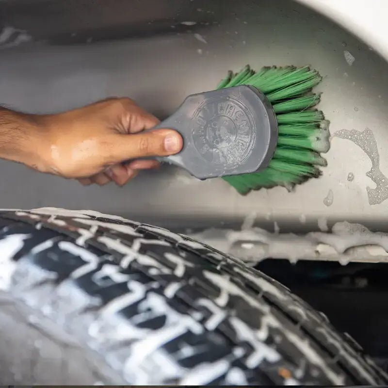 Green-bristled Chemical Guys Wheelie Wheel & Tire Brush for deep cleaning
