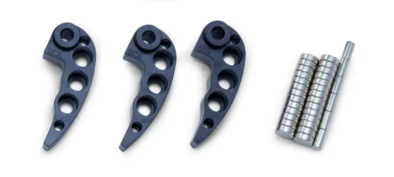 Dark grey metal clutch weights and cylindrical weights from the Clutch Kit for RV and truck parts