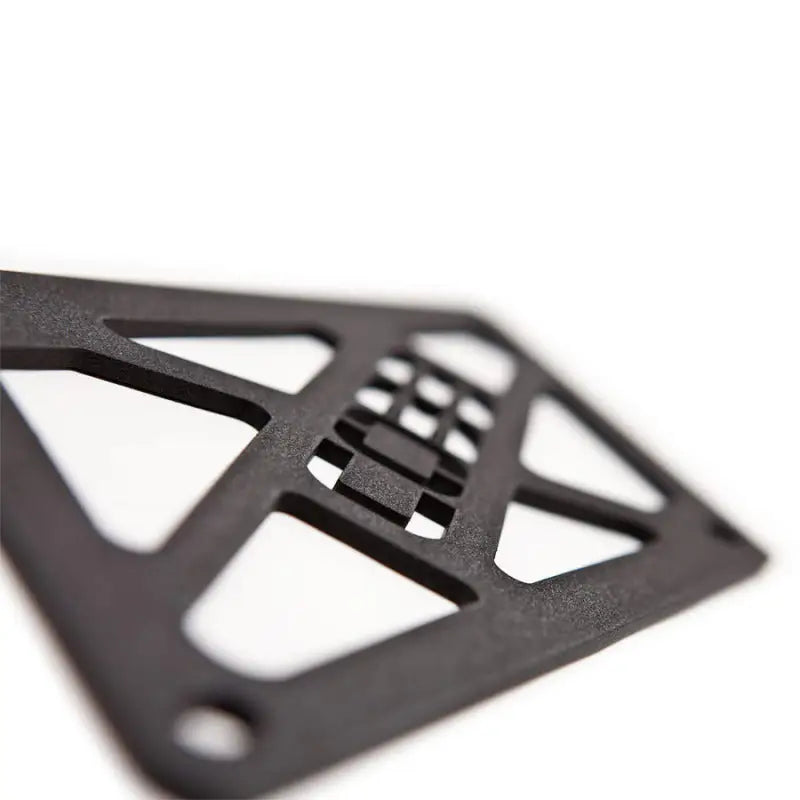 Dark textured open-frame grid pattern of Mitsubishi Evo stealth black hard pipe kit