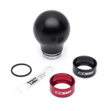 Black Cobb Subaru 6-Speed Weighted Shift Knob with red and black collars displayed together