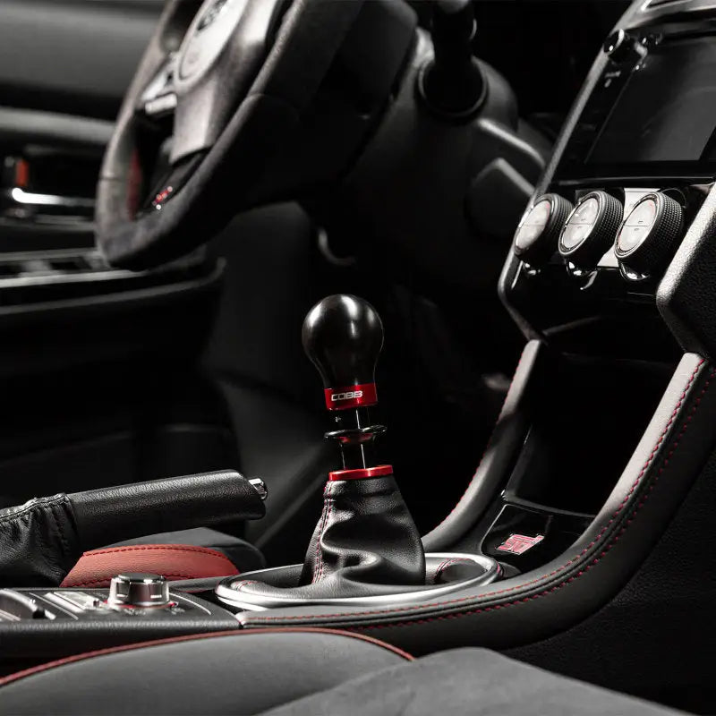 Black and red gear shift knob for Cobb Subaru 6-speed, includes collars