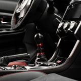 Black and red gear shift knob for Cobb Subaru 6-speed, includes collars