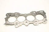 A Cometic Gasket Honda CRX/Civic/Integra - VTEC 81mm .030 inch MLS Head Gasket, featuring four round cylinder openings and multiple bolt holes, is showcased against a plain white background. This intricately shaped gasket is designed to fit over the engine block's cylinders and maintain a perfect seal.