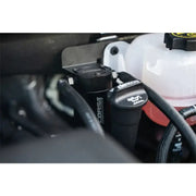 CORSA Performance Aluminum Oil Catch Can w/ Bracket installed in a Silverado engine bay.