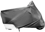 Motorcycle covered with gray tarp using Covermax Medium Cover For 80-200cc