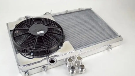 CSF Full Size Slim Radiator with 12in SPAL Fan & Shroud for Mitsubishi Evo 7/8/9 - High-performance cooling, adjustable fittings included.