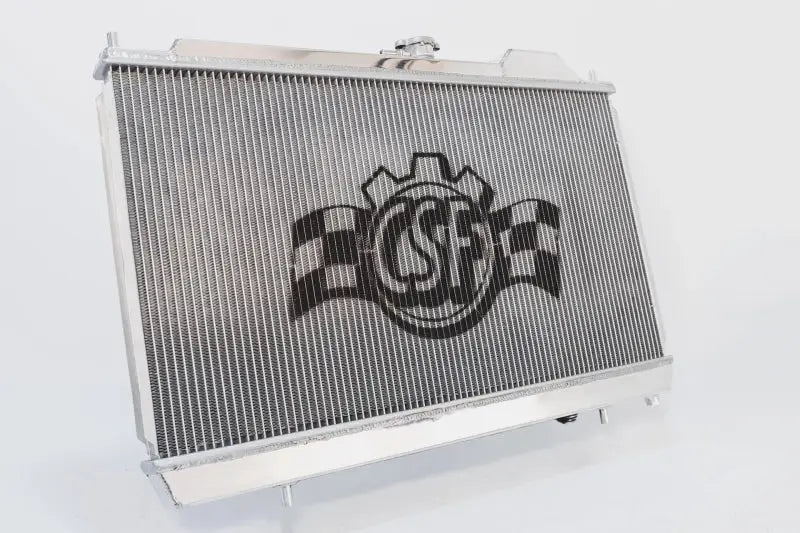 CSF full-size slim radiator with 12-inch SPAL fan and shroud for Mitsubishi Evo 7/8/9, featuring adjustable -16AN and slip-on fittings.