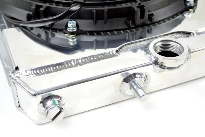 CSF 01-07 Mitsubishi Evo 7/8/9 full-size slim radiator with 12-inch SPAL fan & shroud, adjustable -16AN and slip-on fittings.